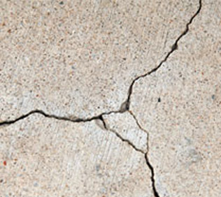 Exterior wall rendering cracks showing in property in Surrey